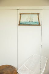 Ship painting with a wormwood frame, showing a sailboat on blue waves, signed Blumberg.