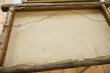 Reverse view of the ship painting, showing wormwood frame, raw canvas, and hanging wire.