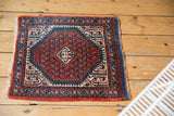 Vintage Mir Sarouk rug corner, thick pile, cranberry red field, indigo border, reciprocating pawn motif.