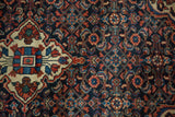 Vintage Persian Hamadan rug's diamond medallion and navy, ivory, ruby red Herati field.