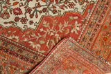 Vintage Farahan Sarouk's intricate red and ivory floral pile with visible hand-knotted back.