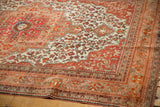 Intricate floral borders and vinery detail on a vintage Farahan Sarouk rug corner.