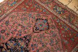 Antique Malayer rug with intricate curvilinear floral medallion. Madder red, navy, azure blue.