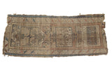 Worn antique Caucasian runner with faded geometric medallions, rectilinear motifs, and a serrated border.