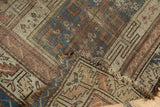 Worn pile, tattered fringe, and geometric patterns on this folded antique Caucasian runner.