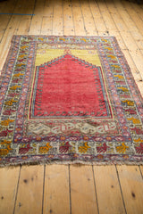 Vintage Melas rug lower Ladik panel, red-saffron patterned borders, and fringe.