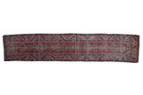 Antique Karabagh rug runner with red geometric medallions and a wide serrated leaf motif border.