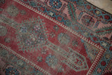 Low, etched pile showing the serrated leaf border of an antique Karabagh runner.