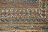 Antique Belouch rug end plainweave showing hard etching, with indigo and madder red borders.