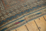 Antique hand knotted Belouch rug end plainweave showing original hard etching, blue, and madder red bands.