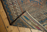 Corner detail of antique Belouch rug with intact goat hair selvage and striped plainweave.