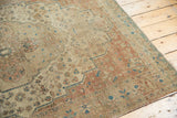 Intricate floral vinery and mostly even wear on an antique Persian Farahan Sarouk rug.