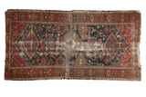 Antique Malayer rug showcasing triple diamond medallions, 'Harshang' field, in rich red and indigo.