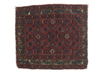 A fine antique Hamadan rug with an allover Herati design on a black cherry red field and a rare green border.