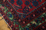 Recessed pile texture within the rare green border of an antique collector Hamadan rug.
