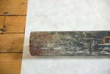 Heavily rusted and worn metal end of the vintage ship map tube.