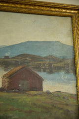Angled detail of the antique landscape painting's aged sky, blue mountains, and decorative gold frame.