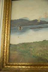 Left side detail of antique New England landscape painting, revealing canvas puncture and gold frame.