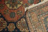 Detail of an antique Tehran rug's tattered corner showing the hand-knotted foundation.