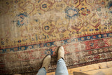Section of antique Caucasian runner, featuring rare yellow ground, geometric motifs, and visible restoration.