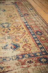 Patina on hand-knotted yellow ground, featuring geometric arabesques in sky blue and terracotta.
