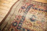 Rare yellow ground antique Caucasian runner with geometric arabesques, floral tendrils, and visible wear.