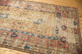 Geometric patterns and visible foundation wear on yellow ground of antique Caucasian runner.