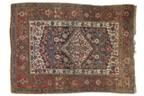 Antique Kurdish Bijar rug: diamond medallion, rams horn motifs, navy, wine red Herati field.