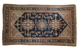 Vintage Persian Hamadan rug, navy triple medallion design with blush and ivory motifs.