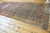 Worn Herati pattern on an Antique Malayer runner, featuring navy blue and blush colors.