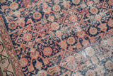 Antique Malayer runner with navy, red blush, and ivory Herati pattern, showing pile wear.