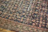 Detail of antique Malayer runner's worn Herati design with visible foundation, navy, blush, and ivory.