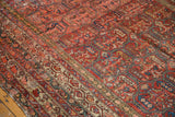 Antique Malayer carpet's intricate multi-panel design with lattice vinery, madder red, blue, and worn pile.