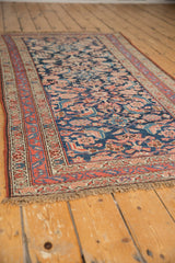 Aged navy Herati pattern and red meandering vine border on antique Kurdish Hamadan runner.