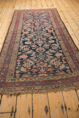 Fringe and red meandering vine main border of the antique Kurdish Hamadan runner.