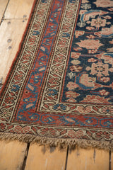 Kurdish Hamadan rug corner with red, navy, ivory borders, secured fringe, and mostly even pile wear.