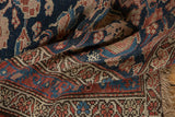 Antique Kurdish Hamadan runner detail: navy, red, ivory Herati pattern, worn pile showing faint foundation.