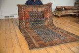 Hand knotted antique Kurdish rug with unique allover boteh design in indigo and faded brick red.