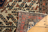 Vintage Persian Afshar rug, ivory tree of life pattern, hand-knotted back, terracotta border.