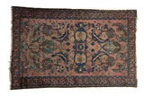 Antique Lilihan rug with blush field, asymmetric medallion, Herati-Mahi motifs, and indigo accents 2'7