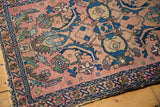 Antique Lilihan rug corner: blush field, indigo border, Herati-Mahi motifs, visible pile wear.