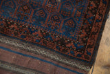 Original plain woven foundation with striped bands adjoining the geometric antique Belouch pile.