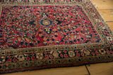 Vintage American Sarouk rug border, cherry red field, and intricate traditional floral patterns.