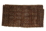 Antique Turkmen tent cover, circa 1910, with repeating floral guls in chestnut, navy, and ivory.