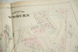Detail view of the engraved title and hand-colored parcels on an antique Woburn, MA map.