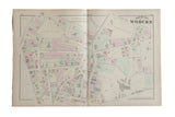An antique 1875 atlas map of Woburn, Massachusetts, showing streets and pastel color-coded properties.