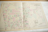 Angled perspective of the open 1875 Woburn, Massachusetts atlas map, showing its full layout.
