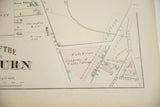 A detailed view of an antique Woburn map showing the Wade Estate, property of Tufts College.