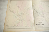 Close view of the antique Woburn map showing the detailed cemetery layout and hand-colored property lots.