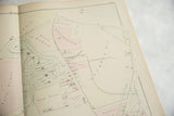 Hand-colored sections on an antique Woburn atlas map detailing the town cemetery plan.